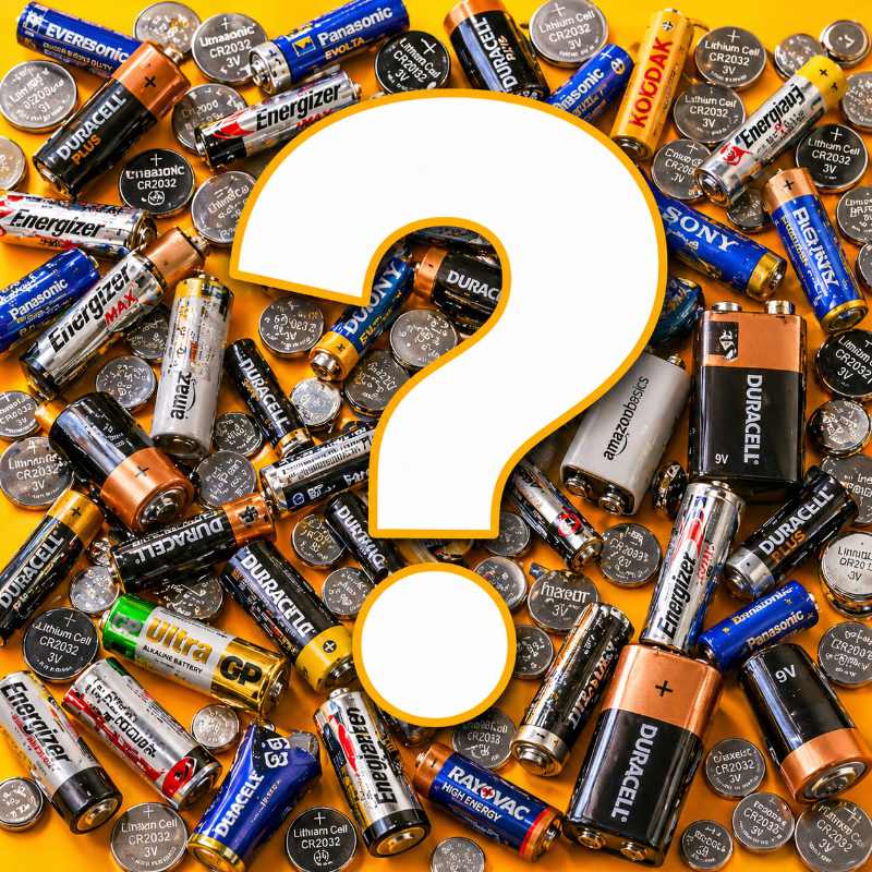 Mixed batteries — AA, AAA, coin cells, 9V and watch batteries jumbled together